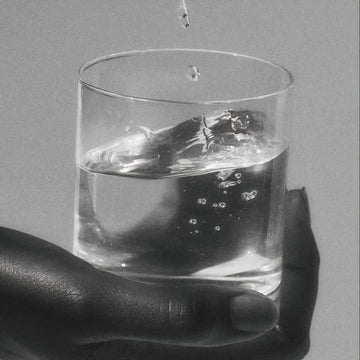 hand holding water glass